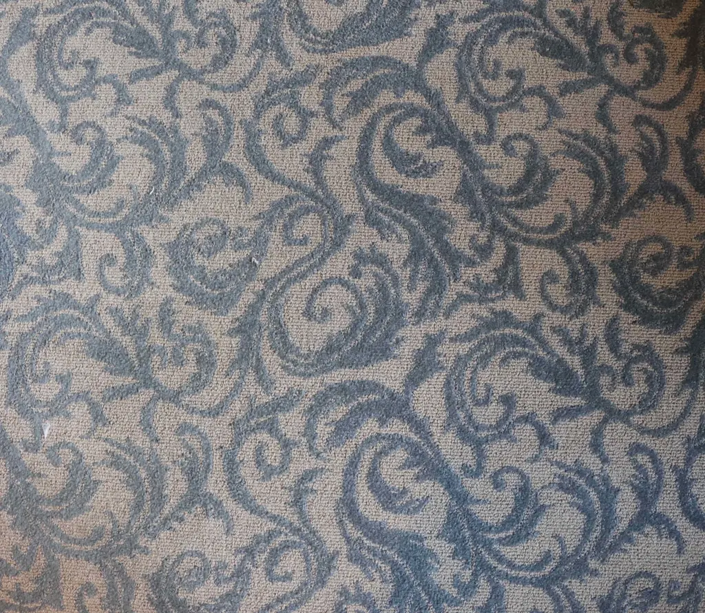 A Large ornately patterned blue and grey artisan carpet -some marks 3950 x 3600mm Image 1++