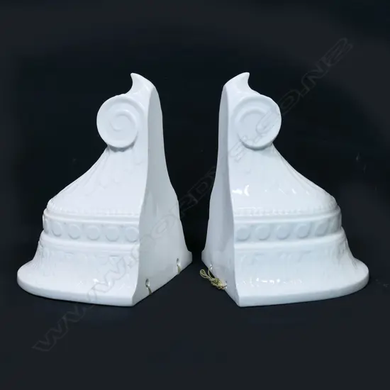 A pair of porcelain hanging flower vases