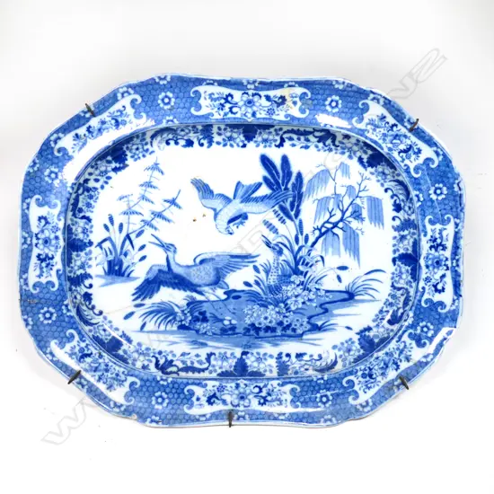 A 19thC blue and white charger, old repair