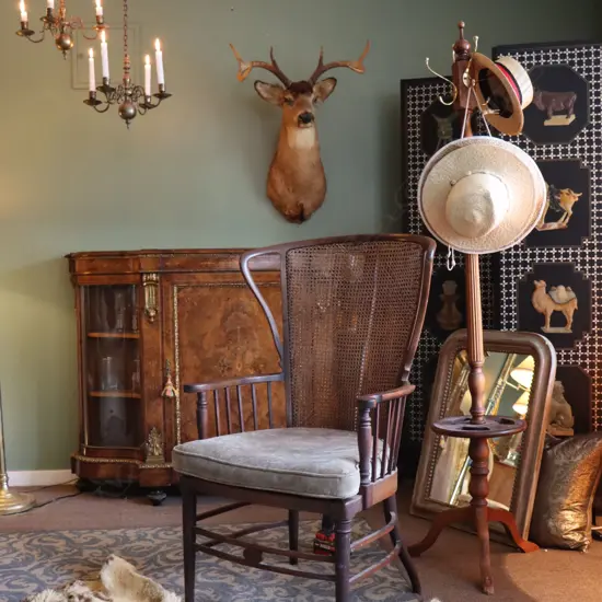 An Edwardian mahogany framed, wing back armchair,