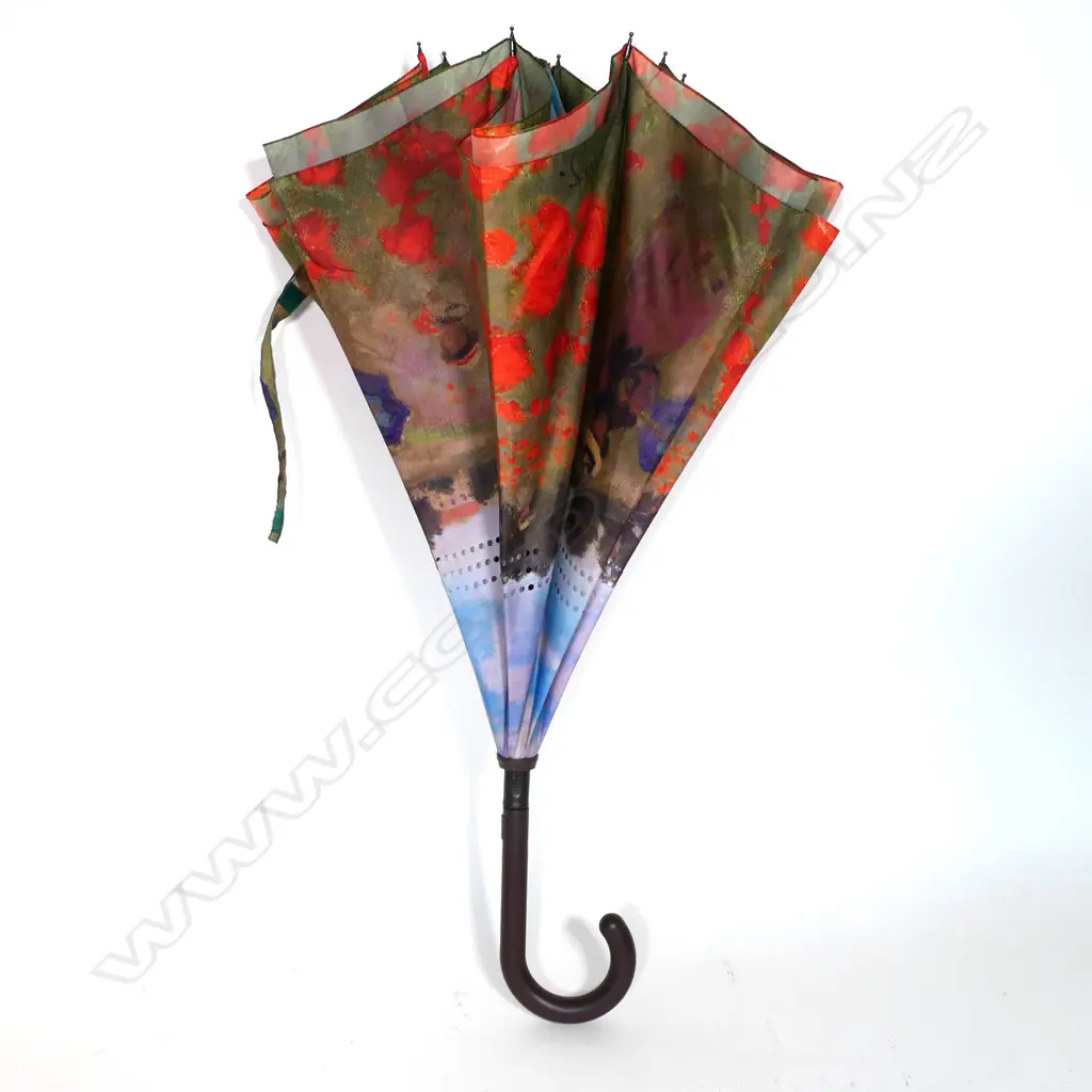 An umbrella features Claude Monet imagery Image 1++