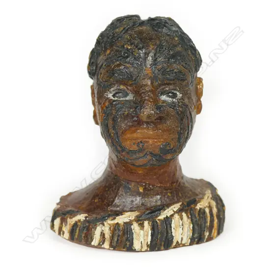 A c1900 carved and painted kauri gum bust of a Māori chief,