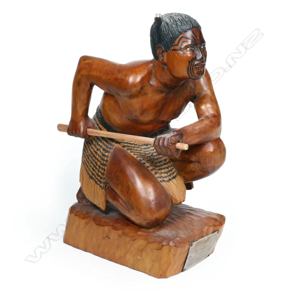 A carved wooden figure of a Māori warrior, Image 1++