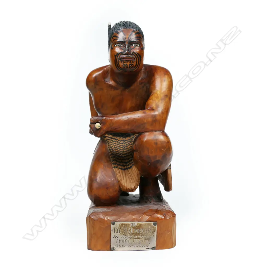 A carved wooden figure of a Māori warrior, Image 1++