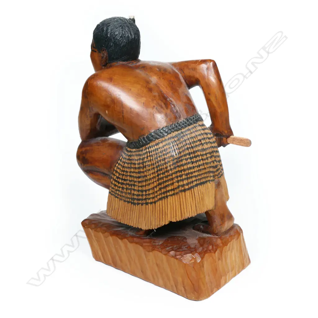 A carved wooden figure of a Māori warrior, Image 1++