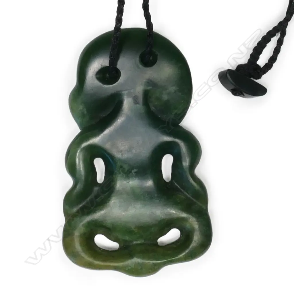 A pounamu hei tiki, kawakawa variety stone, with paua ring eyes, Image 1++