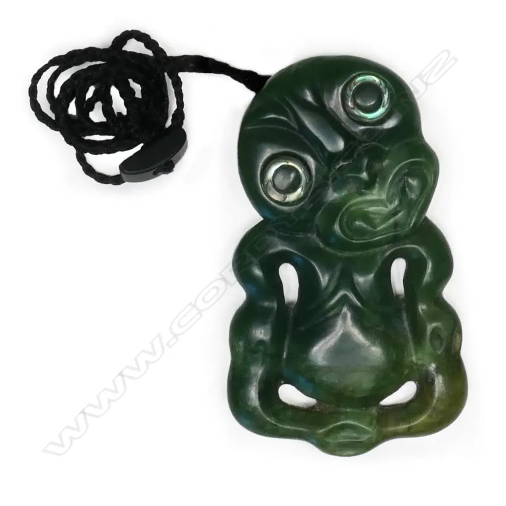 A pounamu hei tiki, kawakawa variety stone, with paua ring eyes, Image 1++