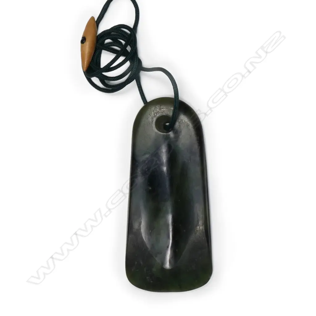 A pounamu toki pendant, Image 1++