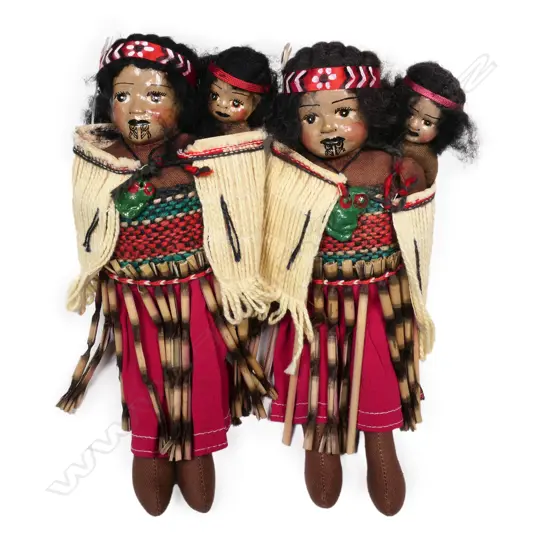 A pair of old handcrafted Māori mother and child dolls,