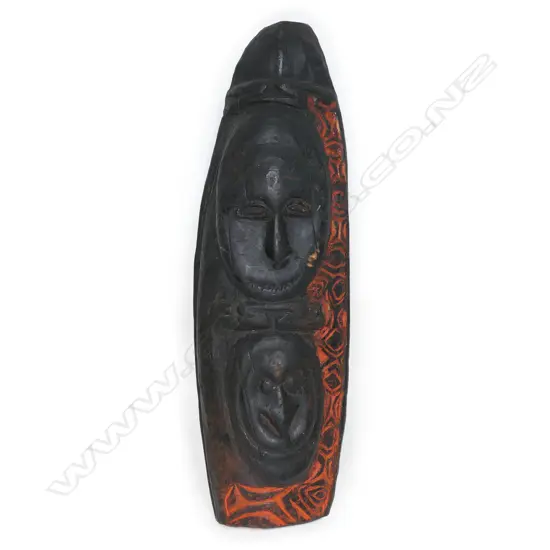 A vintage PNG ancestral double mask carving,
