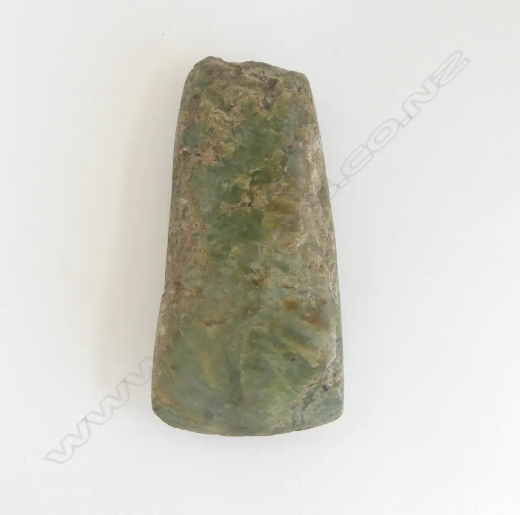 An old Māori pounamu toki of wide flat tapered form Image 1++