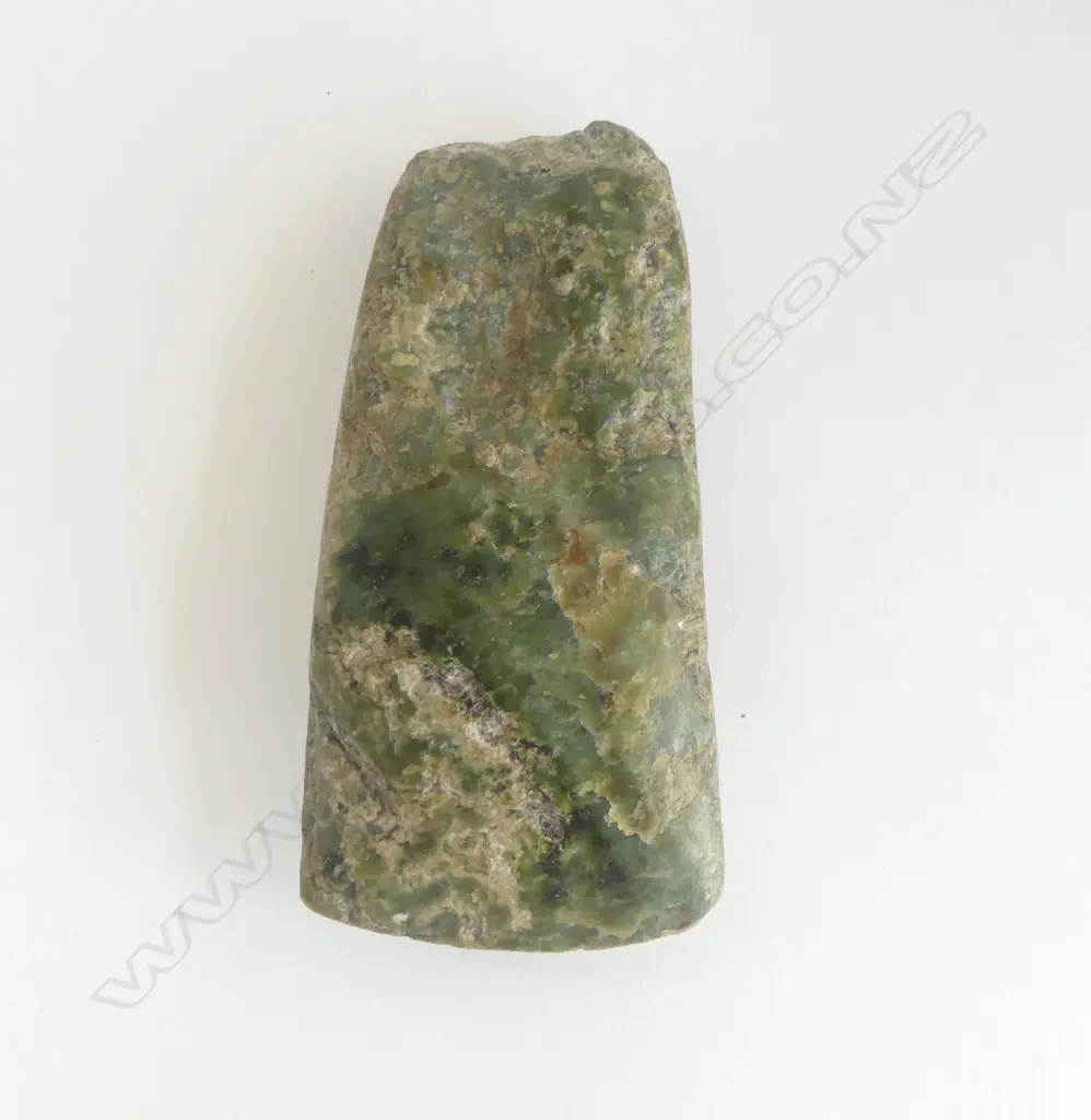 An old Māori pounamu toki of wide flat tapered form Image 1++