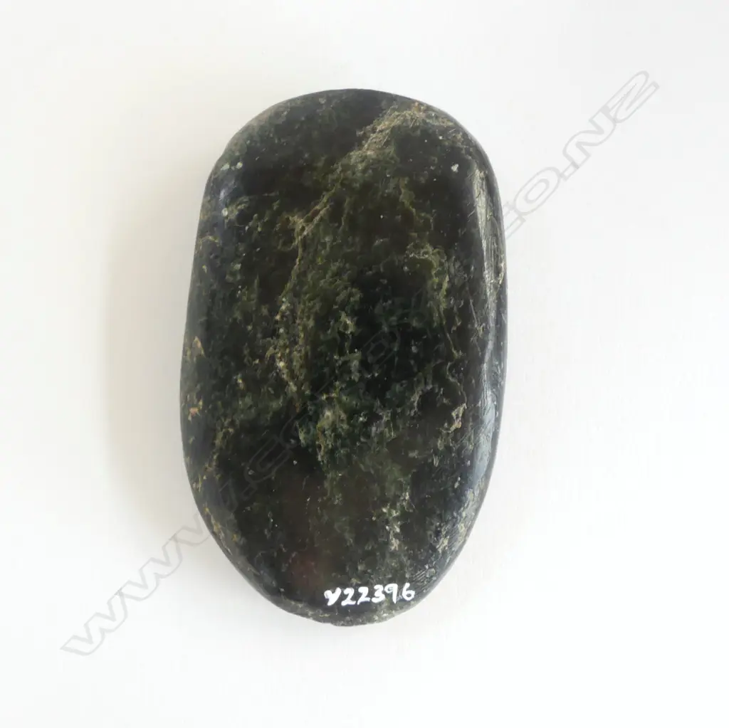 An old Māori worked pounamu flat oval piece, Image 1++
