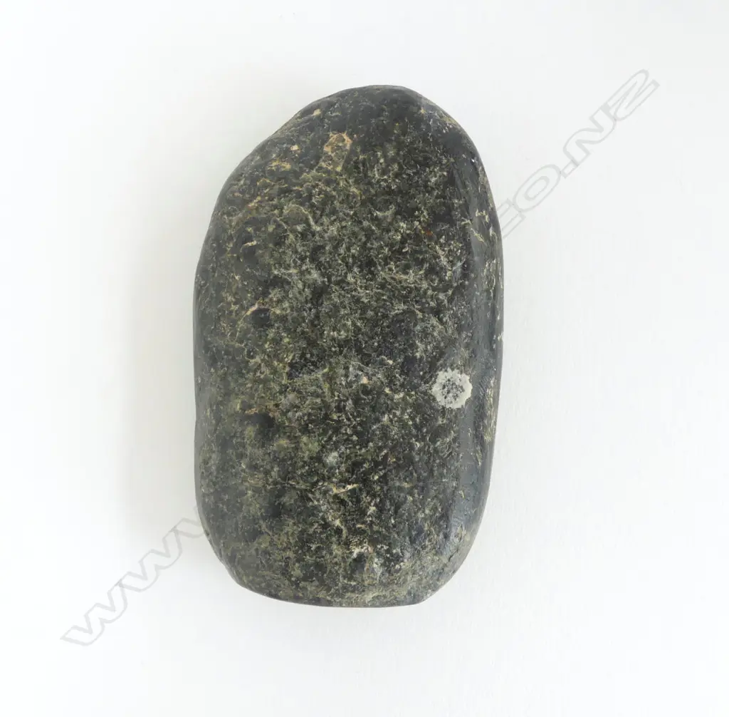 An old Māori worked pounamu flat oval piece, Image 1++