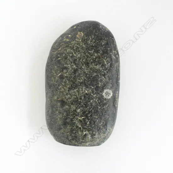 An old Māori worked pounamu flat oval piece,