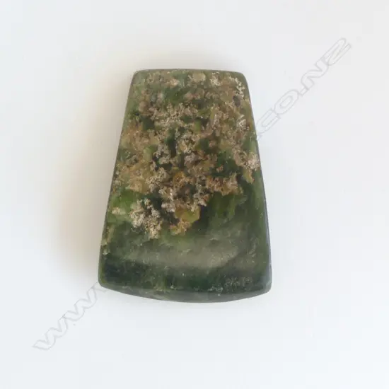 An old Māori pounamu toki of flat wide tapered form,
