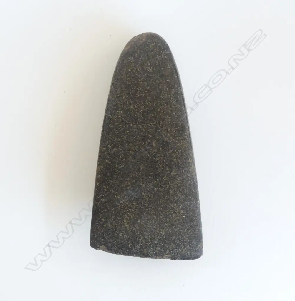 An old Māori toki of dark tone with fine fleck, Image 1++