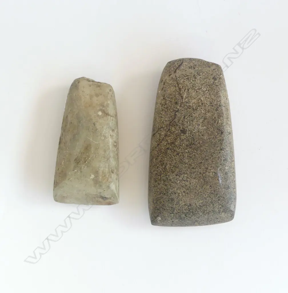 Two old Māori stone toki the larger of speckled grey stone, Image 1++