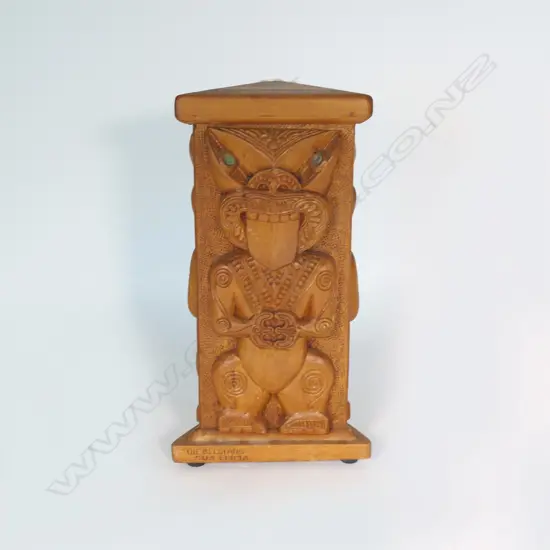 A 20thC Māori carved triangular column with three stylised standing tekoteko type figures,