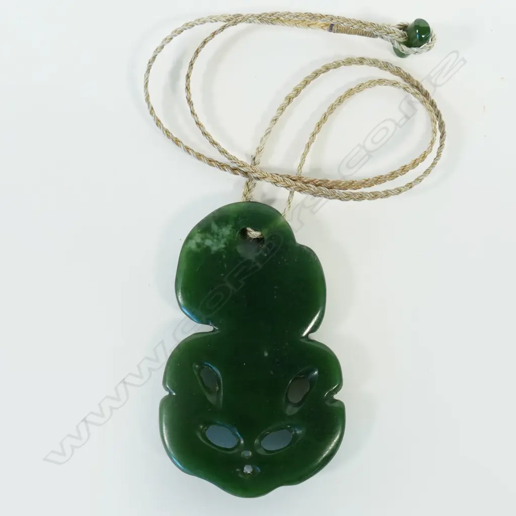 A contemporary pounamu Māori hei tiki, Image 1++