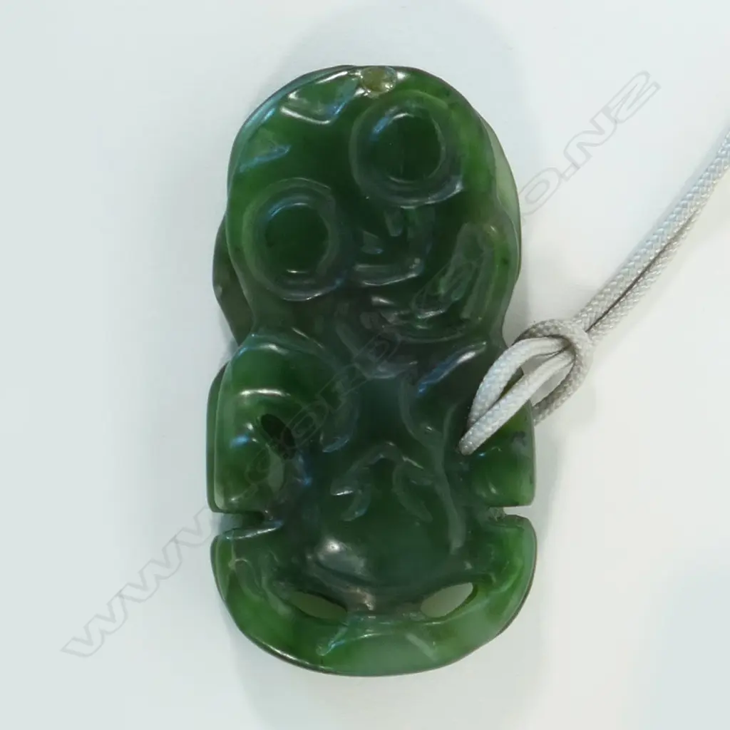 A contemporary Māori double sided pounamu hei tiki, Image 1++