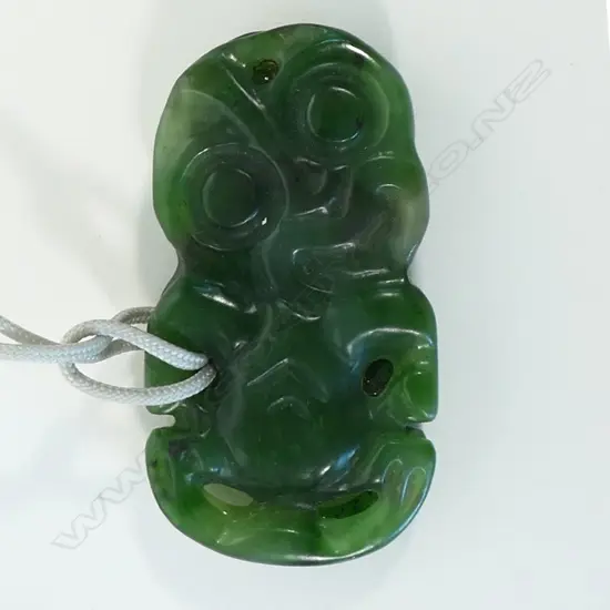 A contemporary Māori double sided pounamu hei tiki,