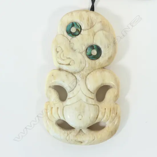 A contemporary whalebone carved Māori hei tiki,