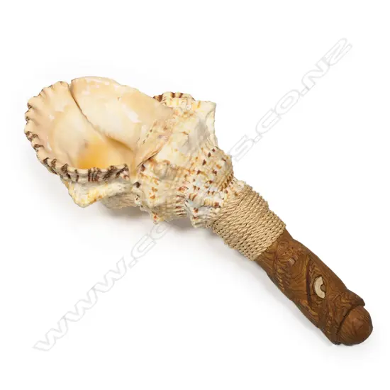 A Māori trumpet with carved wooden mouthpiece trumpet