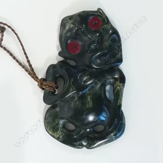 Māori carved pounamu hei tiki with well-defined features