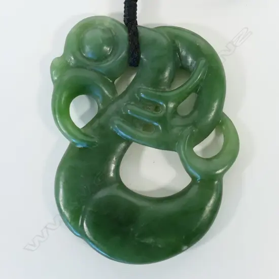 A contemporary large Māori Manaia carved pounamu pendant,