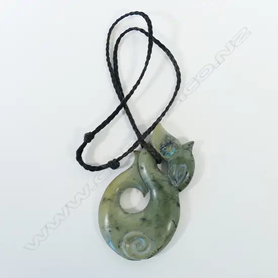 A contemporary large Māori Manaia carved pounamu pendant,