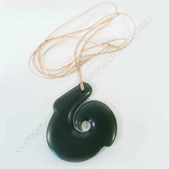 A contemporary large and elegant Māori hei matau carved pounamu pendant,