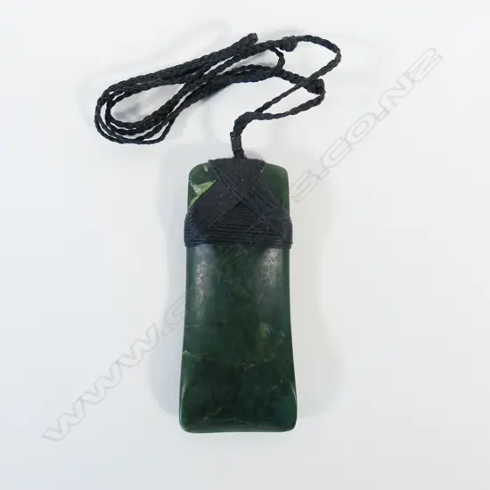 A contemporary Māori carved pounamu hei toki,