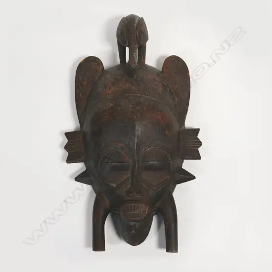 An African vintage carved bird face mask