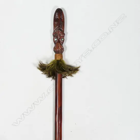 Māori Taiaha carved with feather and paua adornment,