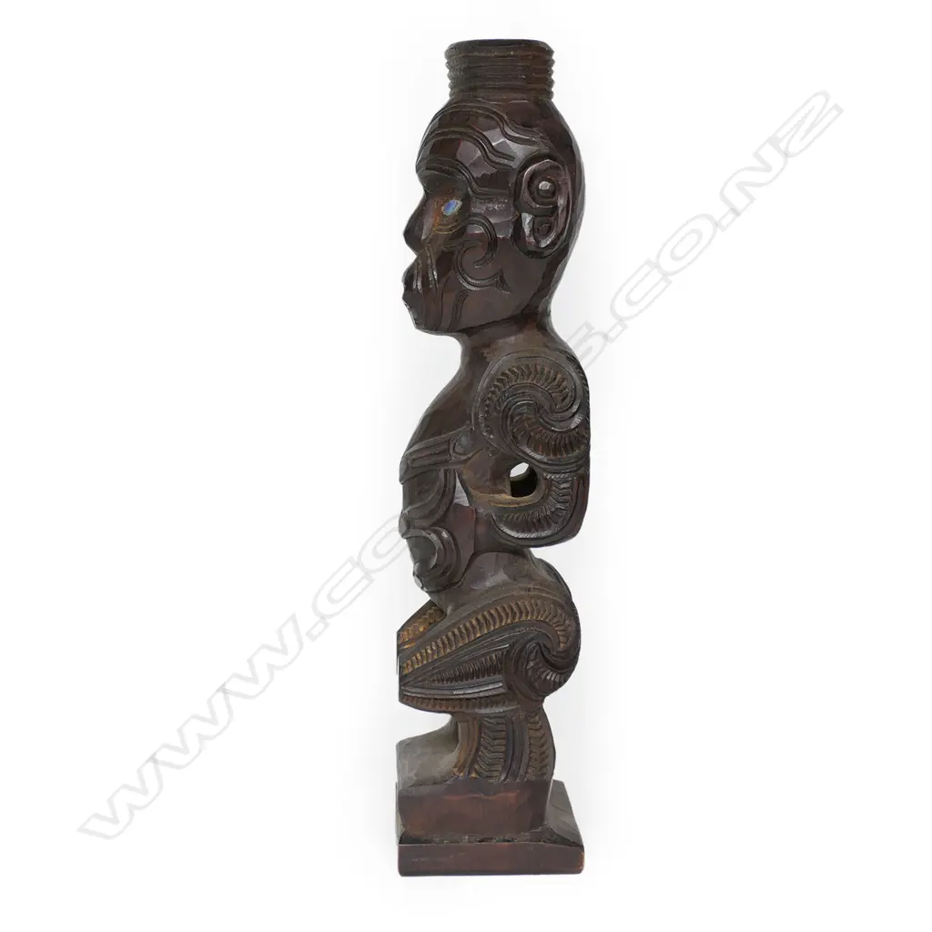 A c.1970a Māori carved tekoteko figure , with spiral, kowhaiwhai and other carved detail, Image 1++