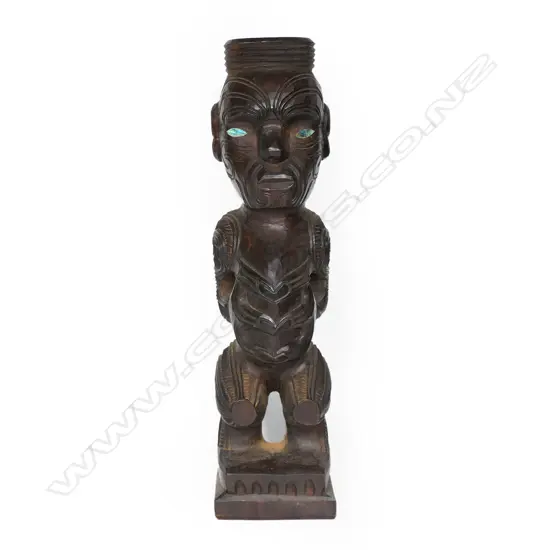A c.1970a Māori carved tekoteko figure , with spiral, kowhaiwhai and other carved detail,