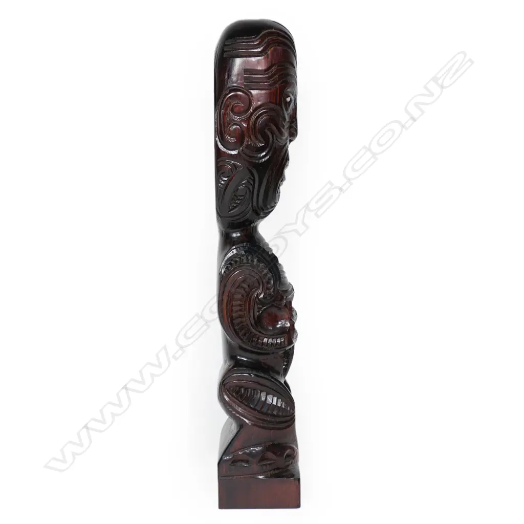 A Māori carved tekoteko figure on a short block base, Image 1++