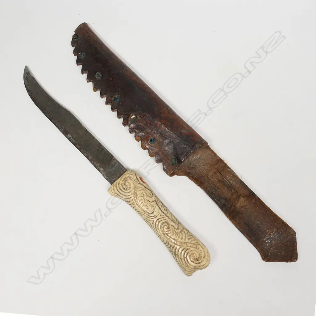 A vintage Māori carved bone handle knife in leather sheath, Image 1++