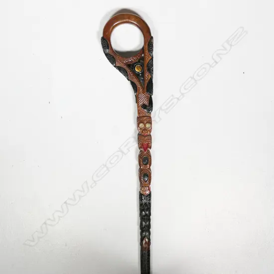 A folk-art carved Māori te toka (walking stick),