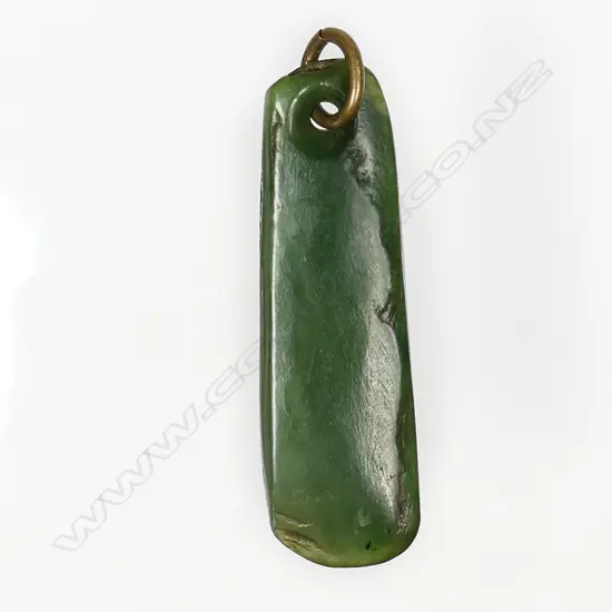 A Māori old pounamu kuru (ear pendant) of near straight sided form,