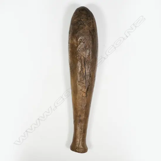 An early Māori wooden flax pounder,