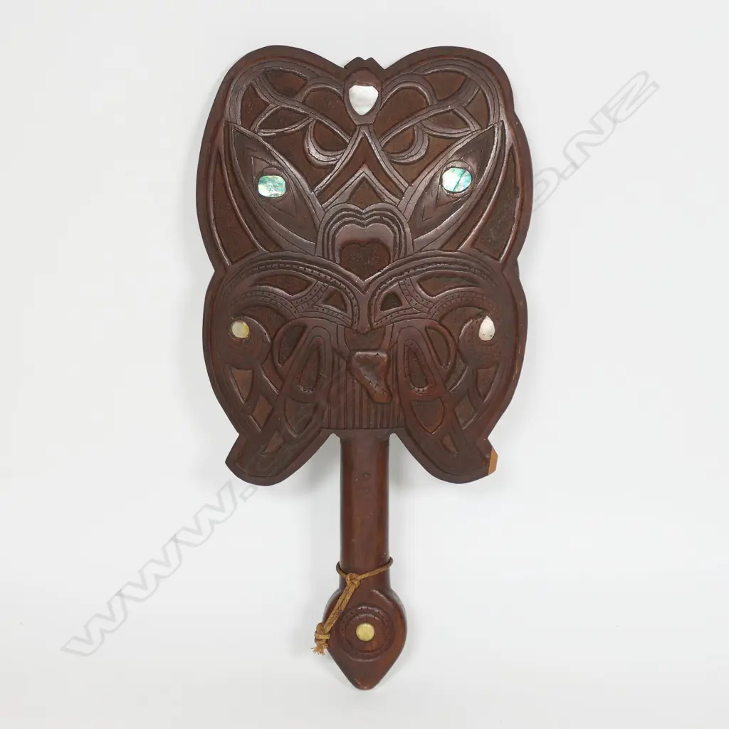 A carved wooden Māori patu, Image 1++