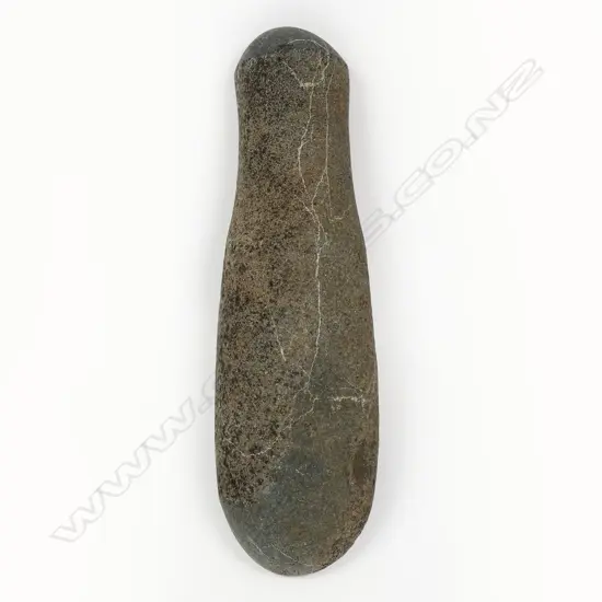 A pre-European Māori patu muka (stone pounder)
