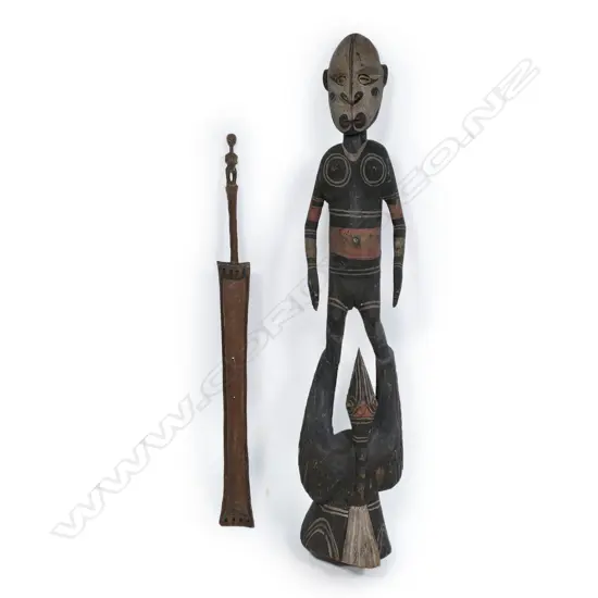 A PNG tall female figure and Solomon Island musical instrument,
