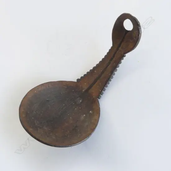 A Pacific Islands carved coconut scoop,