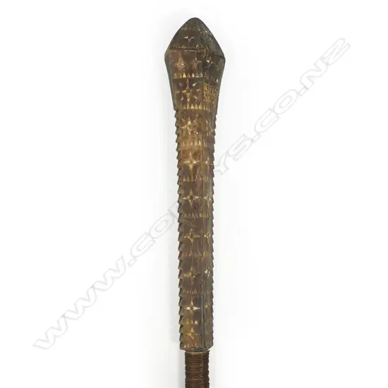 A Samoan serrated war club,
