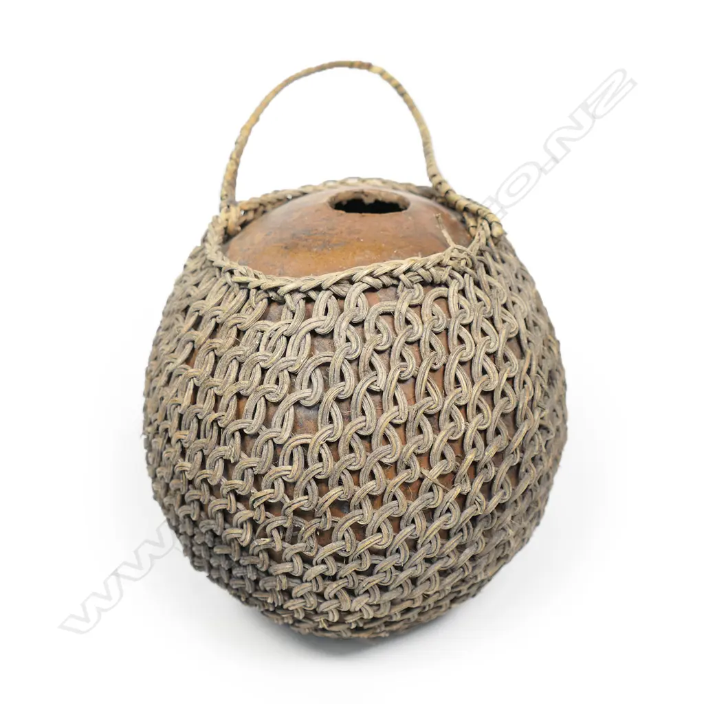 A vintage woven fibre covered coconut shell water flask, Image 1++