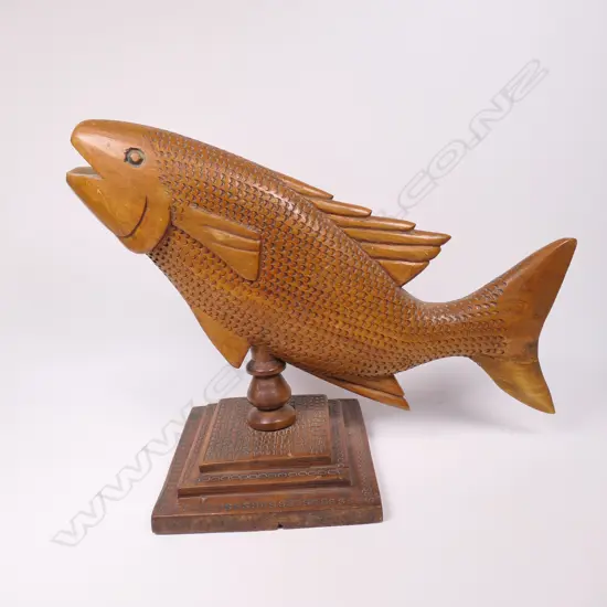 A vintage Pitcairn Island carved flying fish,