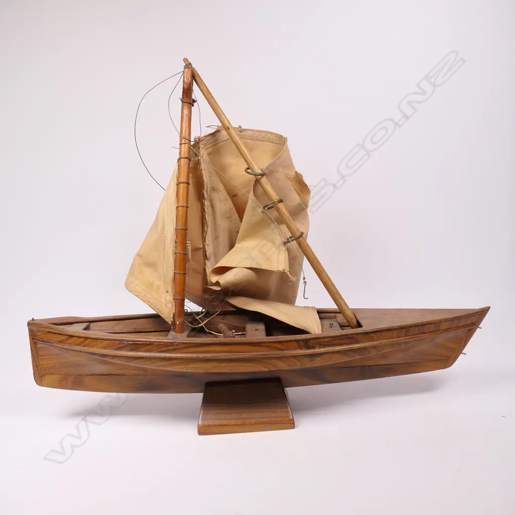 A vintage Pitcairn Island craved wooden long boat on stand, Image 1++